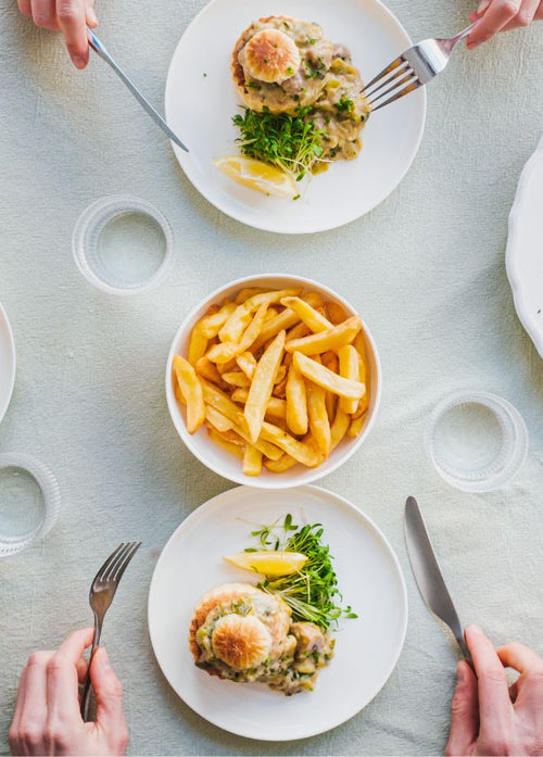 A dinner table with delicious Solid Stash meals